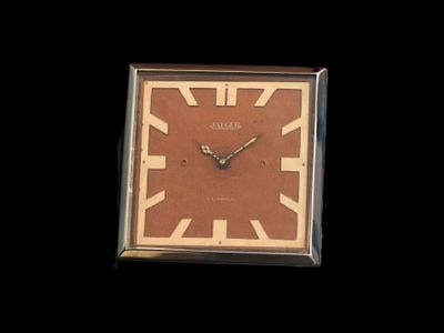a picture of a clock that is on a black background
