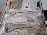 a box of glasses sitting on top of a table