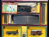 a box with a train set in it on a table
