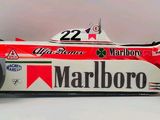 a red and white race car with a number 22 on the side