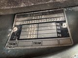a close up of a car ' s engine label on the side of the vehicle