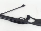 a black rifle on a white background with a gun in the foreground
