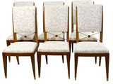 set of four mid - century style dining chairs with upholstered upholstered seats