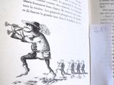 un livre ouvert sur lequel figure le dessin d'un homme jouant de la trompette
