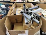 a lot of cardboard boxes full of different types of pipes