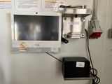a monitor mounted on a wall in a hospital room