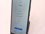samsung galaxy s9e with a wireless charging dock on display