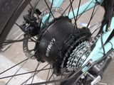a close up of a bicycle wheel with a chain attached to it