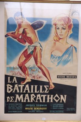 framed movie poster of a man and a woman in a bathing suit