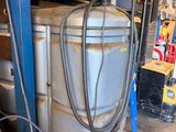 an image of a large metal tank in a garage