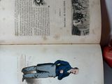 an open book with a drawing of a man in a blue jacket