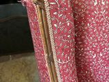 a red chair with a floral pattern on it