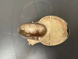 a metal object that is on a metal surface