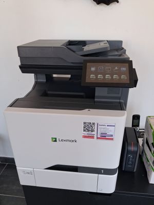 a printer that is sitting on top of a table