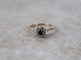 an image of a diamond ring on a table