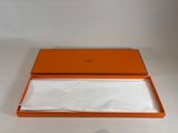 an orange box with a white napkin inside of it