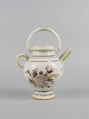 an image of a white teapot with flowers on it