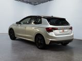 an image of a silver car in a showroom