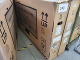two cardboard boxes stacked on top of each other on the ground