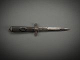 an image of a knife on a gray surface
