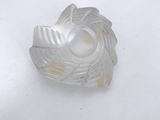 a plastic object that is sitting on a white surface