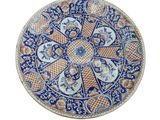 an image of a blue and orange plate on a white background