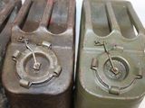 two metal containers sitting next to each other on a table