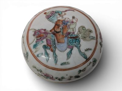 a white box with a picture of a woman riding a horse
