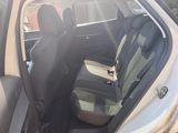 the back seats of a car are empty in the parking lot