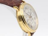 an image of a close up of a wrist watch with a brown strap