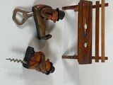 three miniature figurines of a man and a woman on a bench