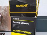 a box of brake shoes on a table next to a book