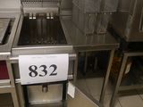 stainless steel counter top in a commercial kitchen with a number 32 on it