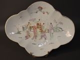 a white plate with a picture of people on it