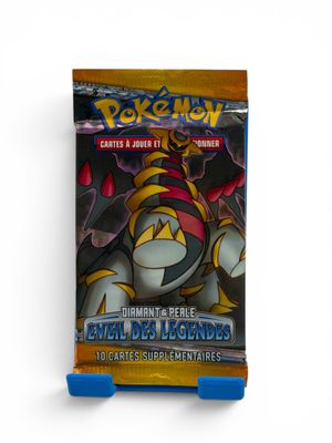 a close up of a box of pokemon cards on a white background