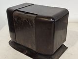 a black toaster sitting on top of a white table