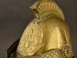 helmet of a roman soldier with a crest on the side of the helmet