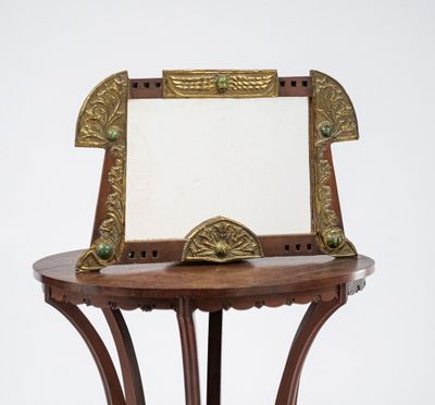 a small table with a mirror on top of it