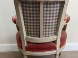 an image of a chair with a plaid back and a red seat