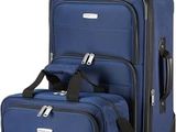 three pieces of luggage sitting next to each other on a white surface