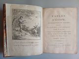 un vieux livre avec l'image d'un homme et d'un chien