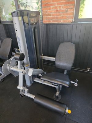 grey and black gym equipment in a gym room with a brick wall
