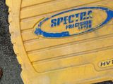 a yellow plastic case with a blue logo on it