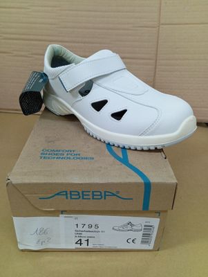 a box with a pair of white shoes on it