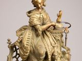 an image of a statue of a woman sitting on top of a table