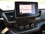 the dashboard of a car with a gps device in the center