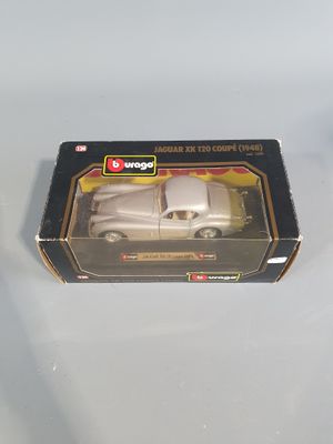 a box with a toy car in it on a table