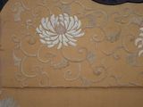 a close up of a piece of fabric with a flower design on it