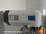 a white mixer with a blue sticker on it