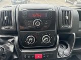 a dashboard of a car with a digital clock on it